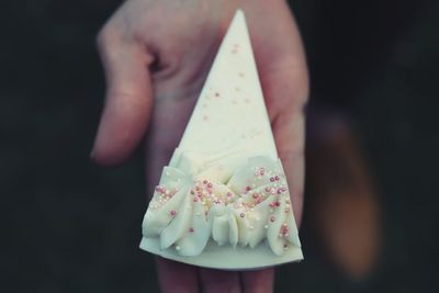 Close-up of hand holding ice cream