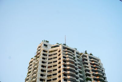 Low angle view of building against blue sky