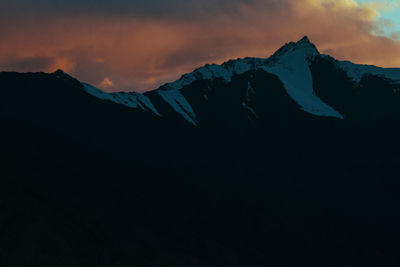 Scenic view of mountains against sky during sunset