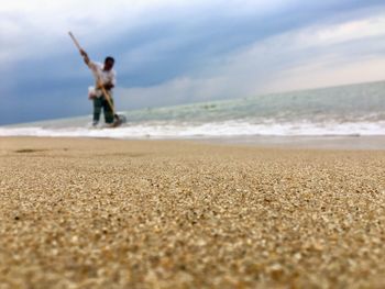 Man cleaning at beach