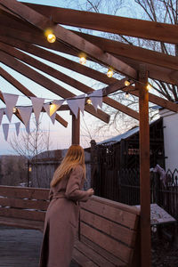 Woman standing in snow