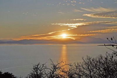 Scenic view of lake at sunset