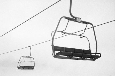 Ski lift hanging from cable