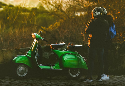 Rear view of man riding motorcycle