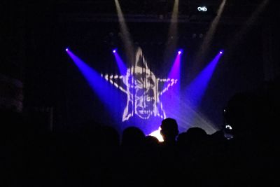 Silhouette people at music concert