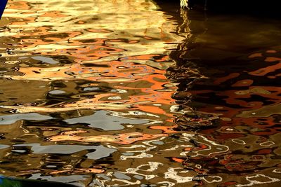 Reflection of autumn leaves in water