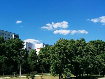 Buildings against blue sky and clouds