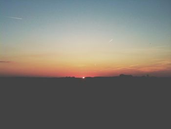 Scenic view of landscape at sunset