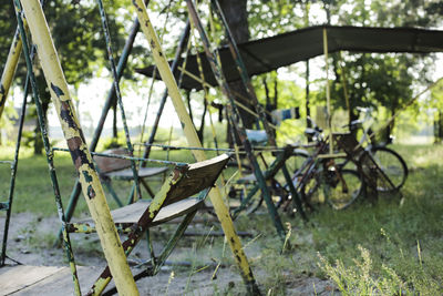 Close-up of abandoned motorcycle on grass