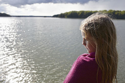 Girl looking at water, skane, sweden