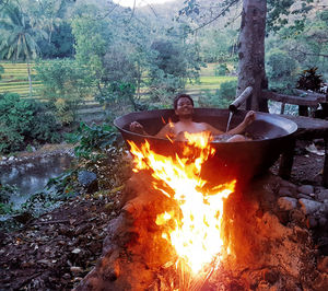 Man with fire crackers in the forest