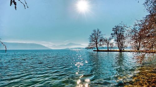 Scenic view of sea against sky on sunny day