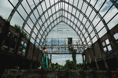 Low angle view of abandoned building against sky