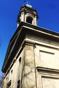 Low angle view of building against blue sky