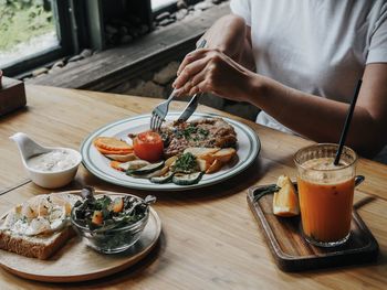 Midsection of man having food
