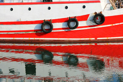 Close-up of boat moored on rope