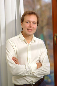 Portrait of smiling man with arms crossed