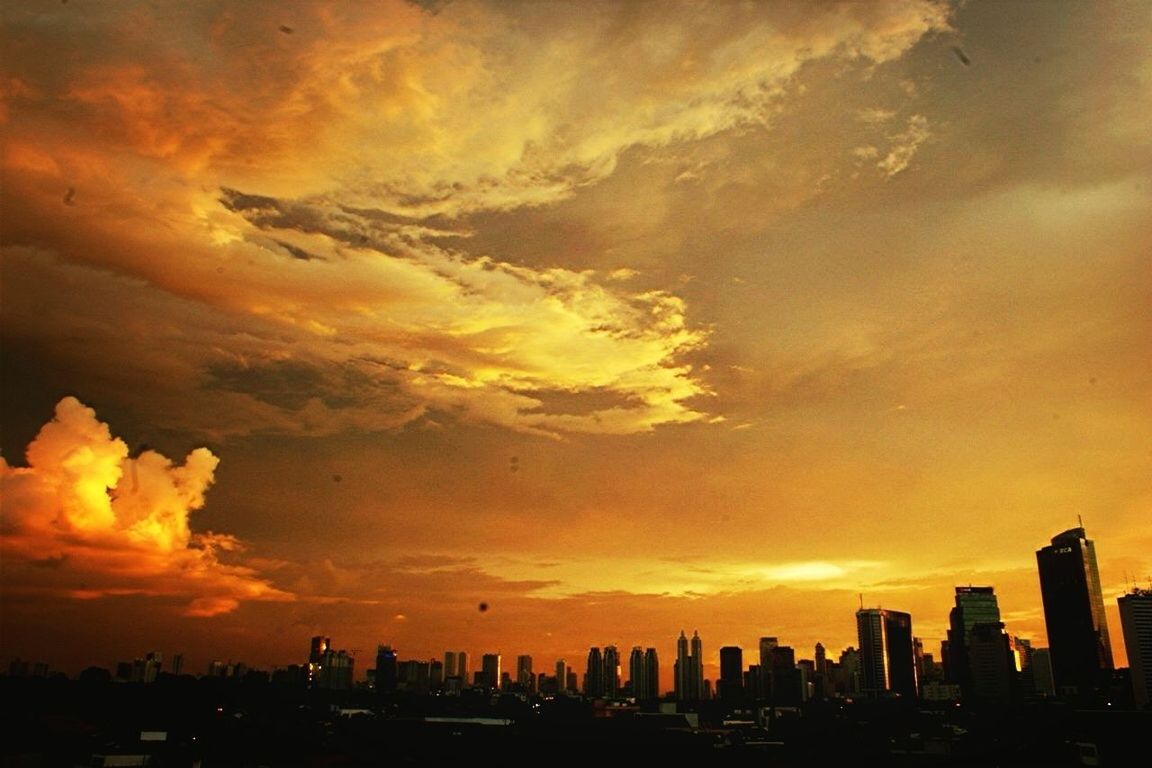 sunset, silhouette, orange color, building exterior, architecture, sky, built structure, city, cloud - sky, dramatic sky, cityscape, skyscraper, beauty in nature, scenics, nature, outdoors, cloud, no people, dusk, urban skyline