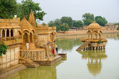 Gadisar lake is surrounded by many temples, holy shrines, and chattris, jaisalmer, rajasthan, india