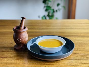 High angle view of mortar and pestle on table