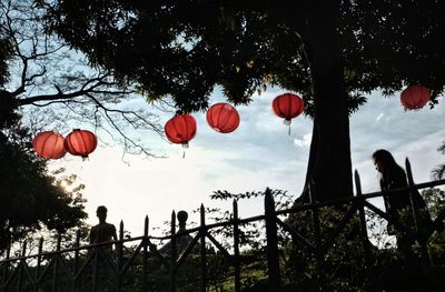 Low angle view of lantern against sky