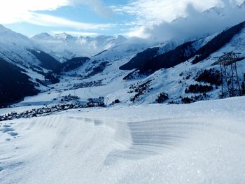 Scenic view of snowcapped mountains against sky