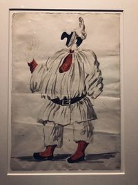 Rear view of person standing by sculpture