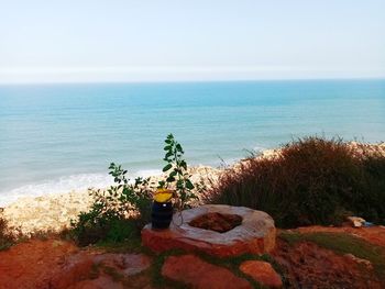 High angle view of rocks on beach against sky