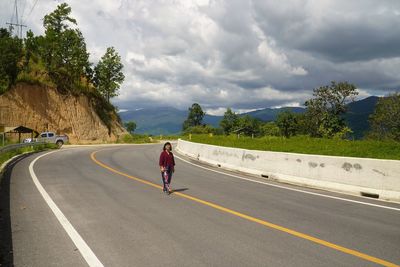 Portrait of a woman on a mountain road