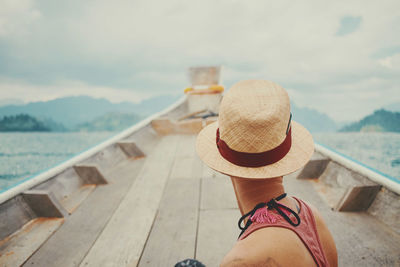 Rear view of woman on boat