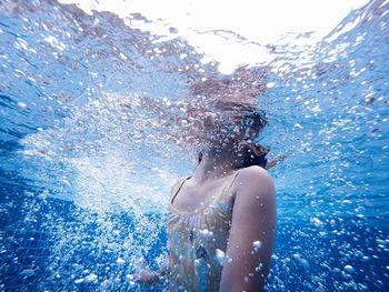 Girl swimming in pool