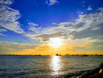 Scenic view of sea against sky during sunset