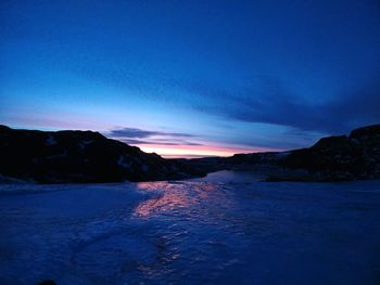 Scenic view of sea against sky at night