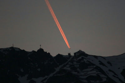 Low angle view of vapor trail against clear sky