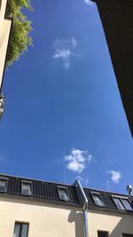 Low angle view of building against blue sky