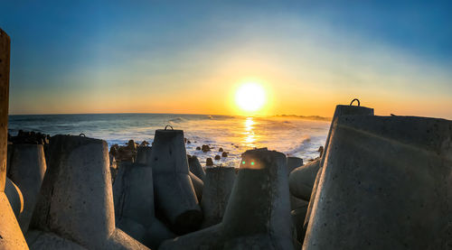 Scenic view of sea against sky during sunset