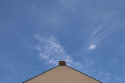 Low angle view of building against blue sky