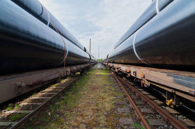 Train on railroad tracks against sky