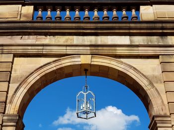 Low angle view of arch building against sky