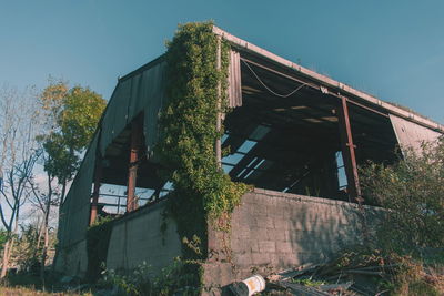 Low angle view of abandoned building against sky