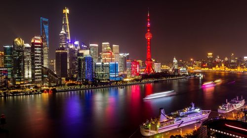 Illuminated buildings in city at night