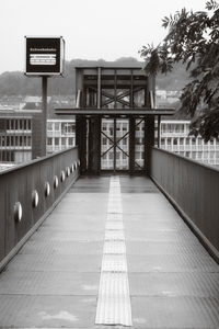 View of text on footpath against building