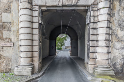 Empty road amidst buildings