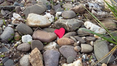 Close-up of heart shape on pebbles