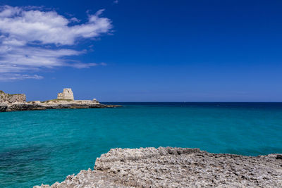 Scenic view of sea against blue sky