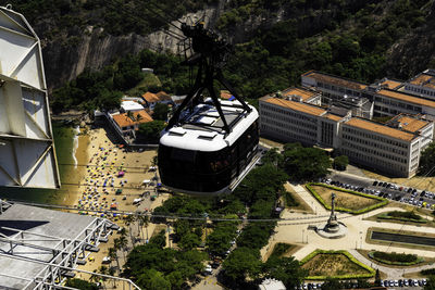 High angle view of buildings and trees in city