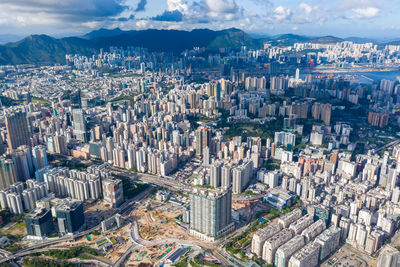 High angle view of modern buildings in city against sky