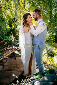 Bride and groom standing outdoors