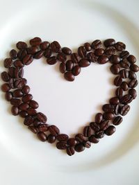 High angle view of heart shape coffee beans