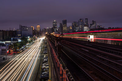 High angle view of light trails on road at night